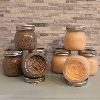 A table with jars of different types of food.