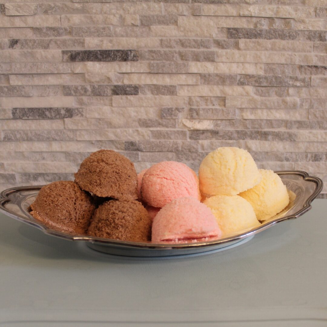 A bowl of ice cream on top of a table.