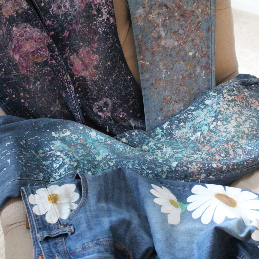 A pair of jeans with flowers on them