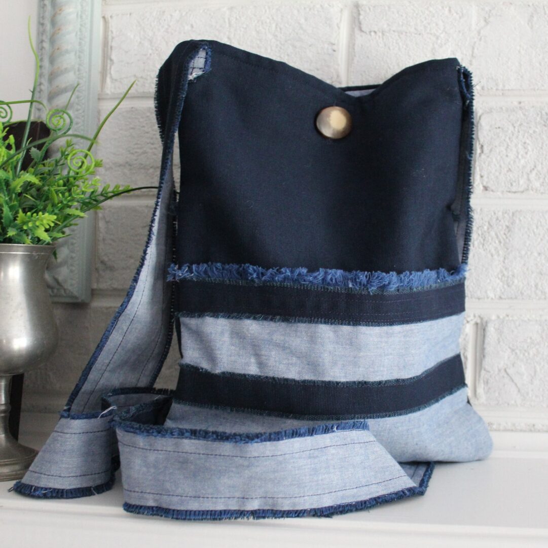 A black and blue bag sitting on top of a table.