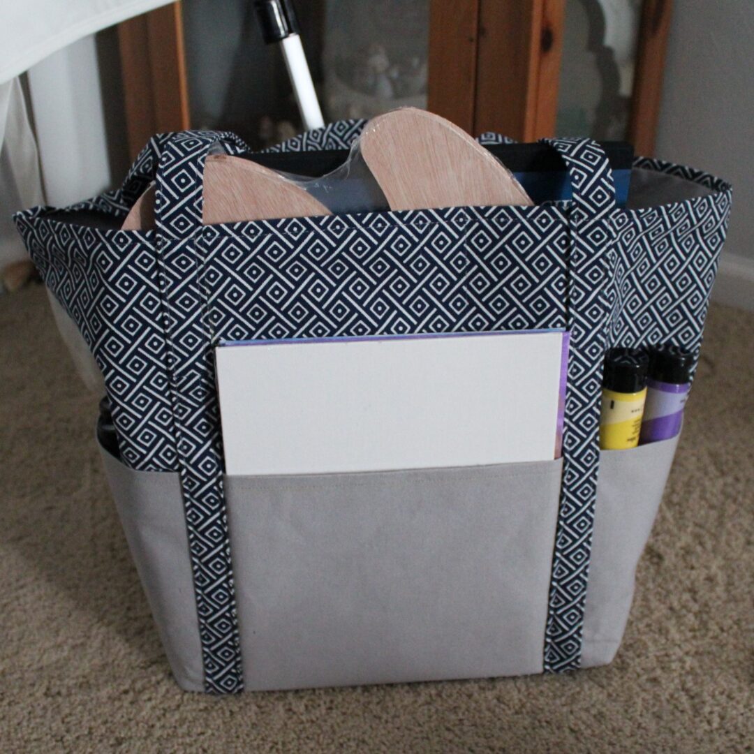 A bag with some papers and pens in it