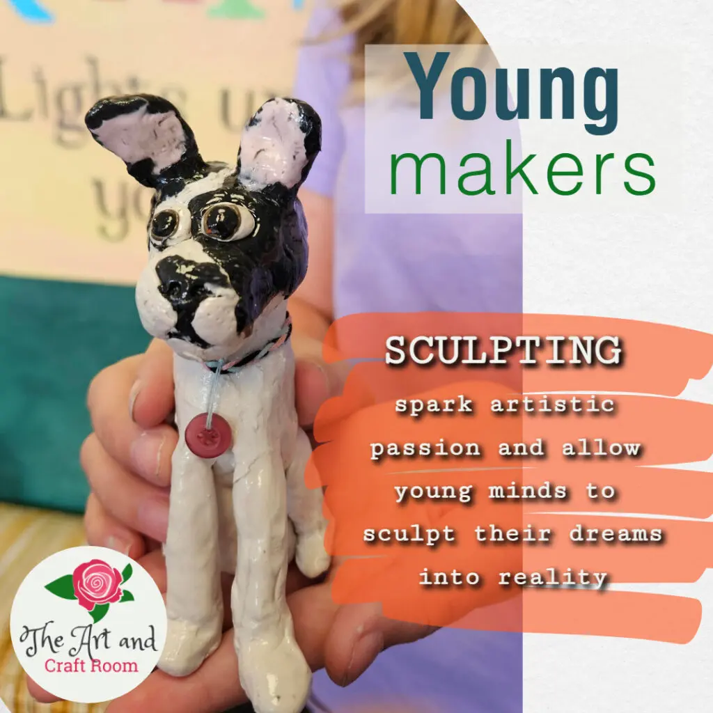 A dog figurine is made of clay and has a pink collar.