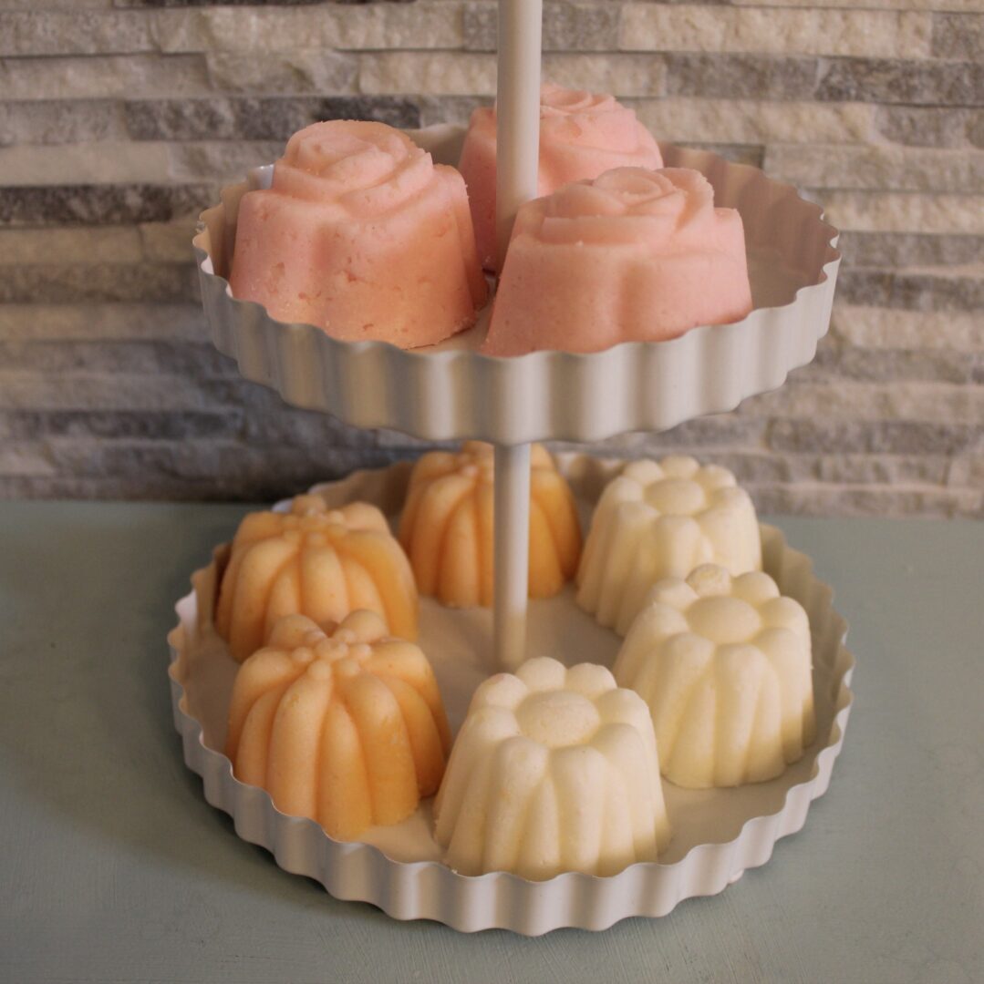A cake stand with two cakes on it